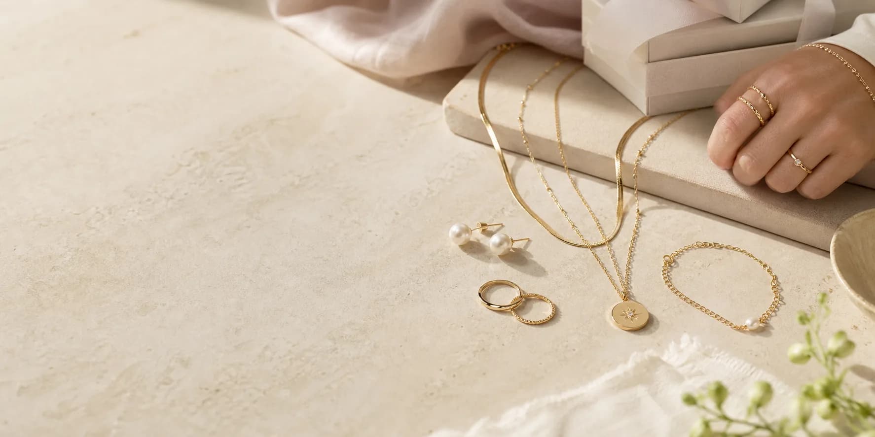 Warm editorial jewelry scene for the collection preview